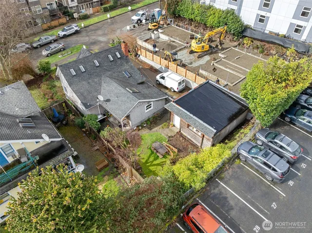 an aerial view of a residential apartment building with a yard