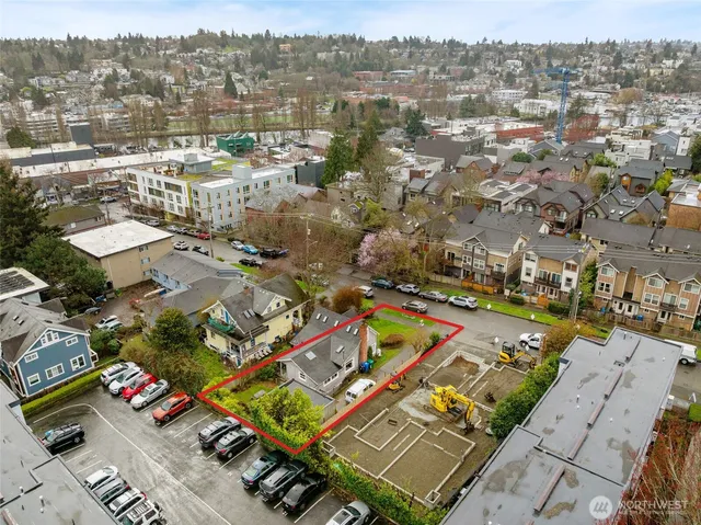 an aerial view of residential houses with outdoor space