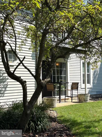 a view of backyard with sitting area and garden