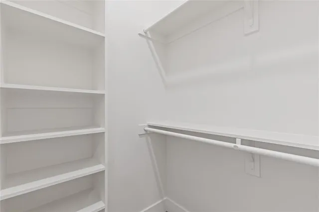 a view of an empty walk in closet