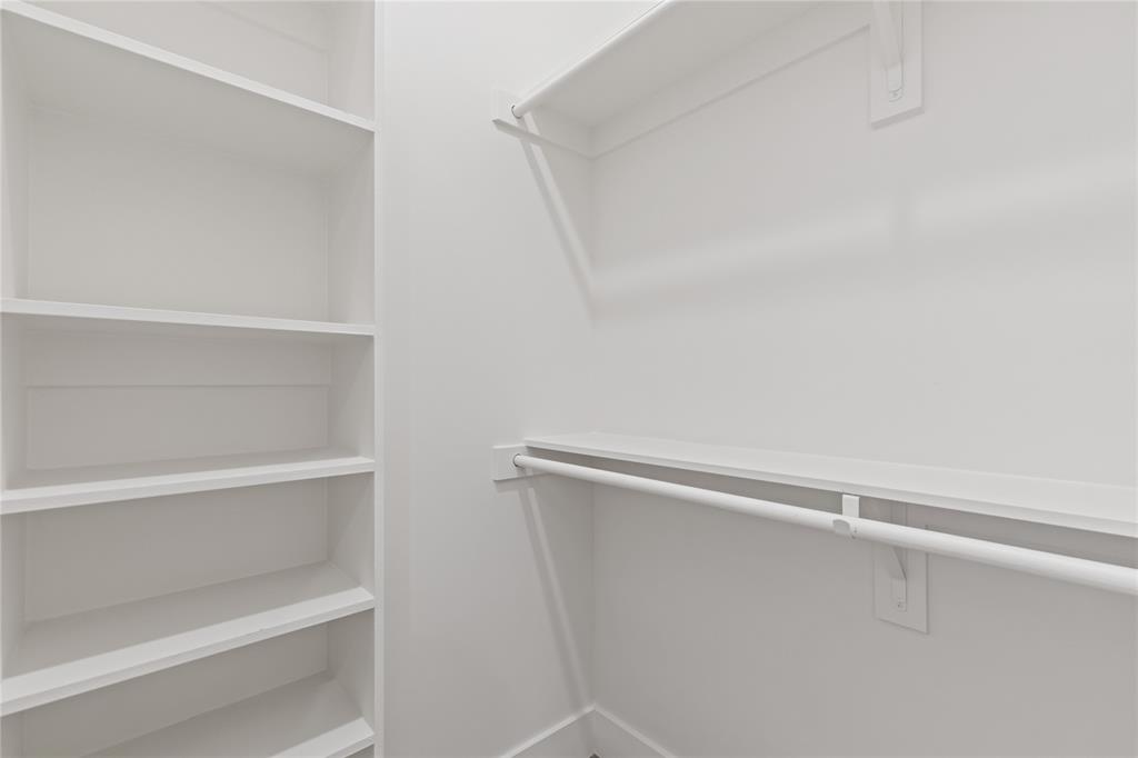 7624 Roper Street Dallas, TX 75209 - Photo 22 of 36 a view of an empty walk in closet