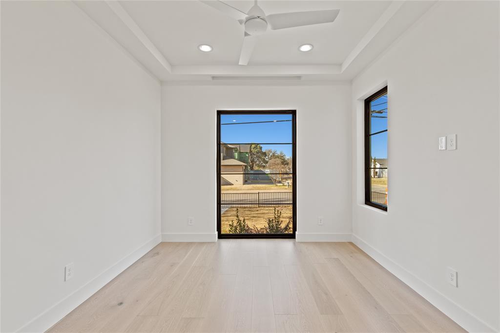7624 Roper Street Dallas, TX 75209 - Photo 23 of 36 an empty room with windows and closet