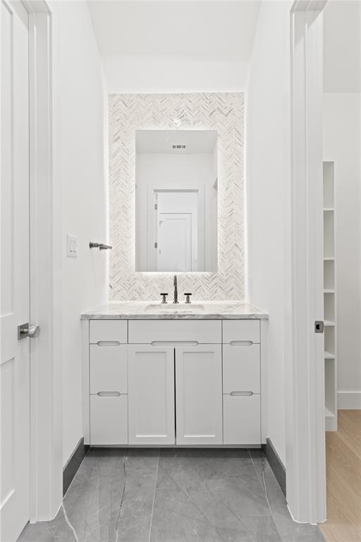 7624 Roper Street Dallas, TX 75209 - Photo 25 of 36 a spacious bathroom with a sink and a mirror