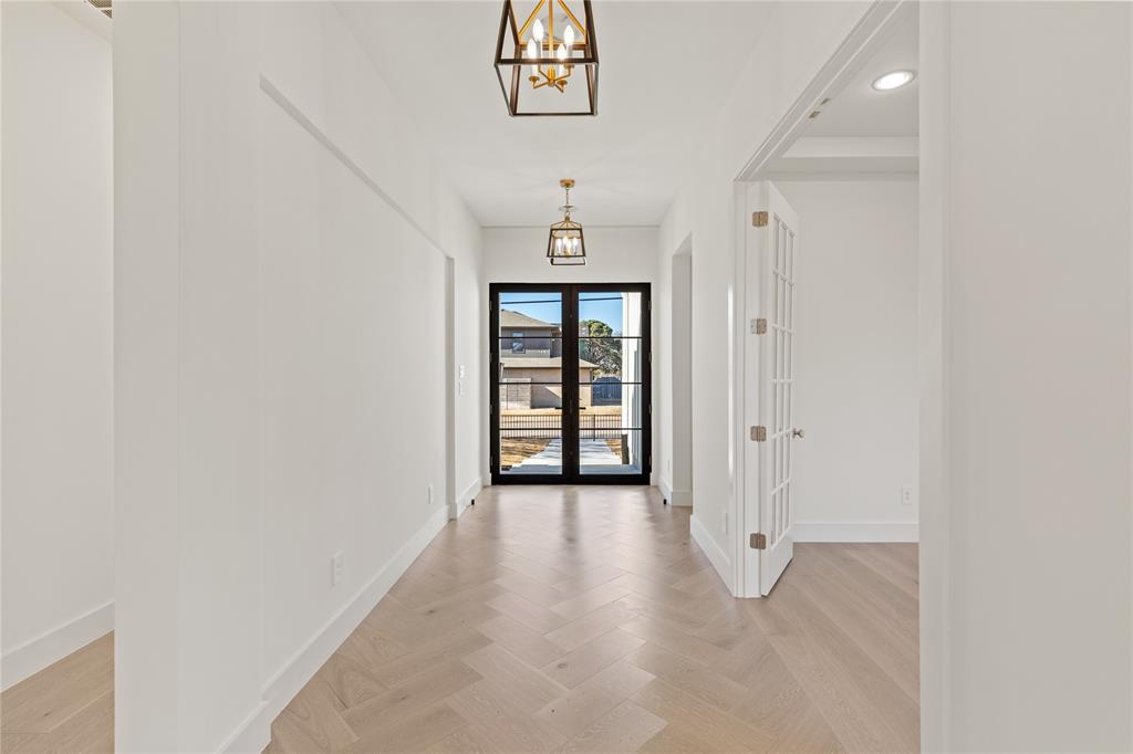 7624 Roper Street Dallas, TX 75209 - Photo 3 of 36 an empty room with windows and cabinet