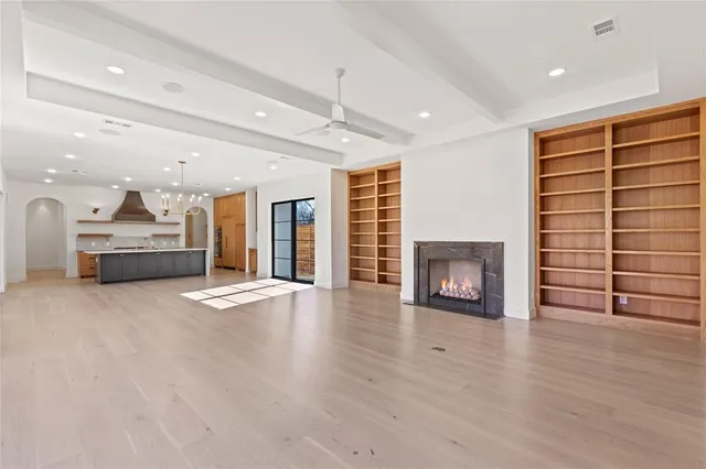 a view of a livingroom with furniture and a fireplace