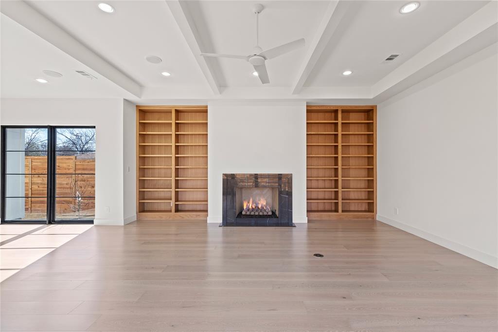 7624 Roper Street Dallas, TX 75209 - Photo 5 of 36 an empty room with windows and cabinet