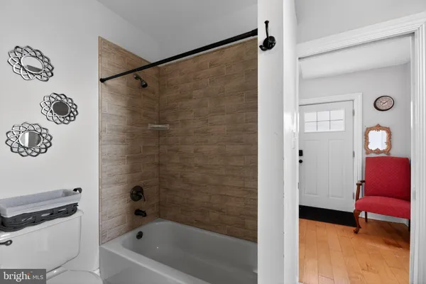 a bathroom with a bathtub and a shower