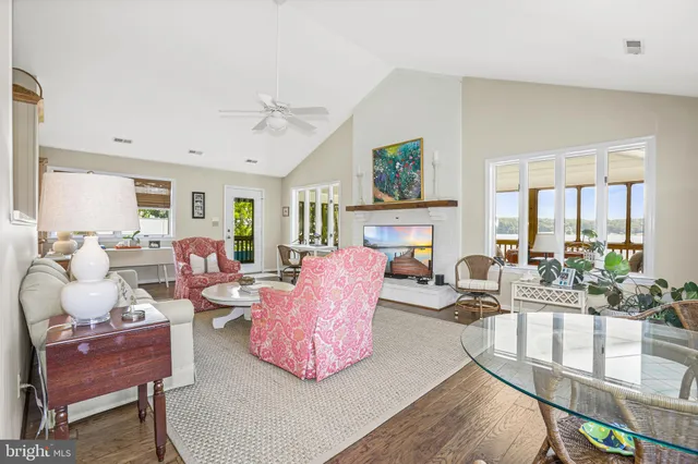 a large kitchen with stainless steel appliances granite countertop a lot of counter space and wooden floor