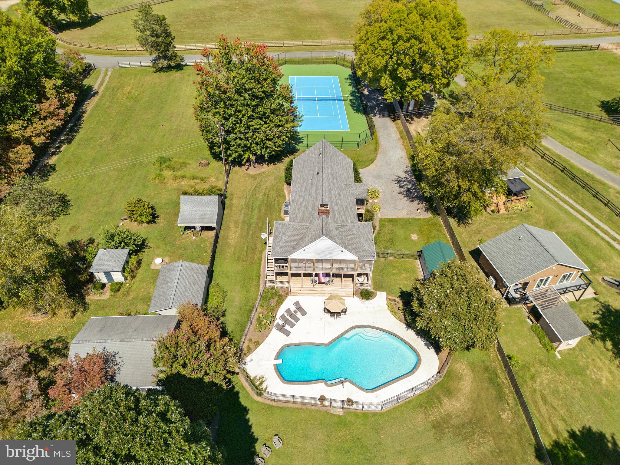 638 Marlborough Point Road Stafford, VA 22554 - Photo 2 of 58 an aerial view of a house with swimming pool and large trees