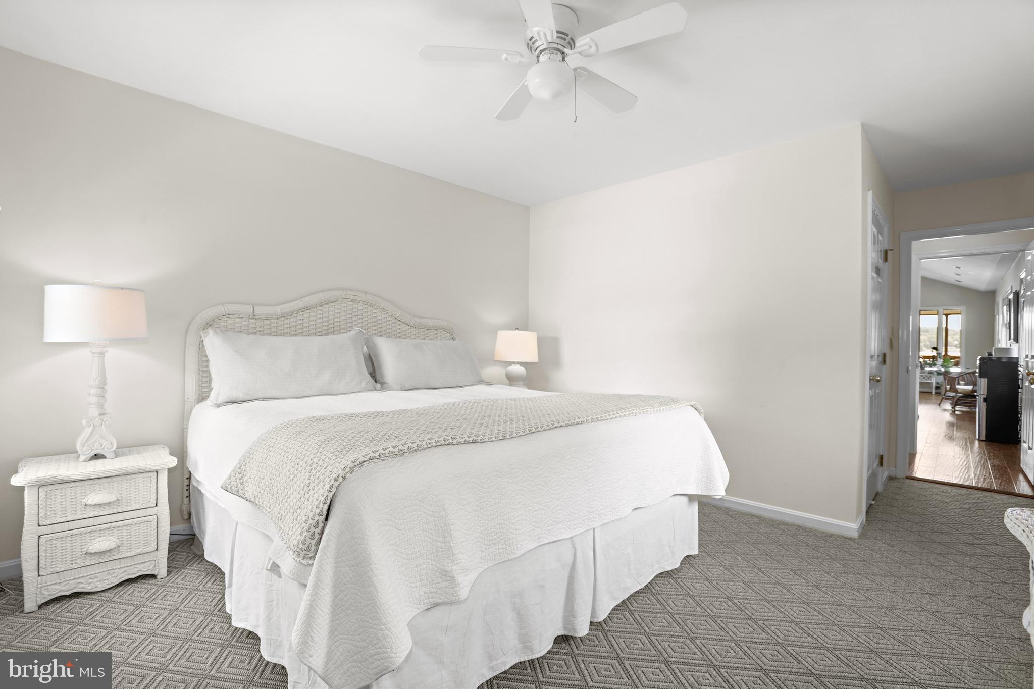 638 Marlborough Point Road Stafford, VA 22554 - Photo 24 of 58 a bedroom with a bed and a chandelier