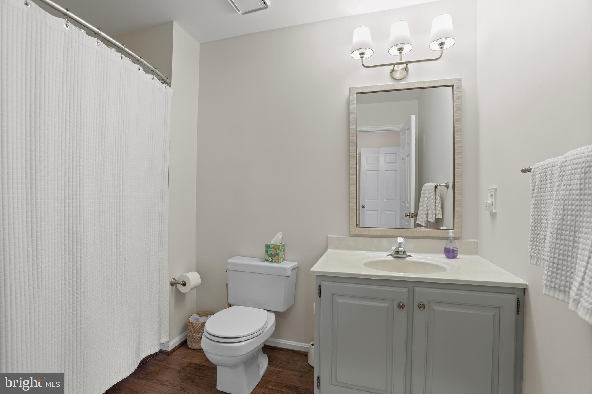 638 Marlborough Point Road Stafford, VA 22554 - Photo 25 of 58 a bathroom with a toilet sink and mirror