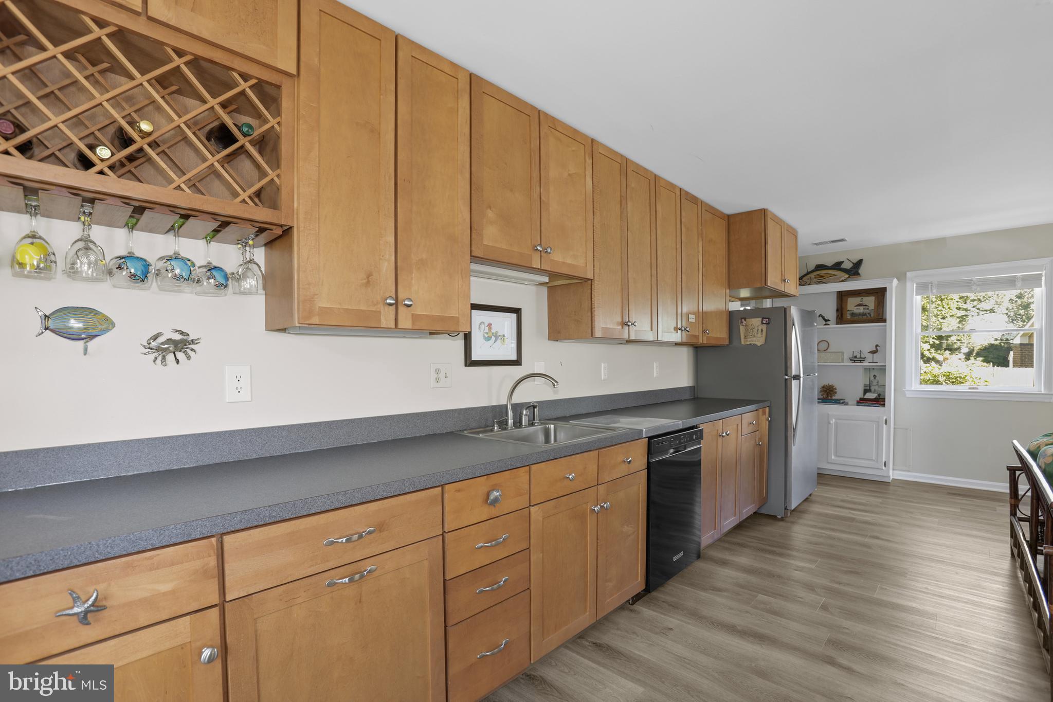 638 Marlborough Point Road Stafford, VA 22554 - Photo 28 of 58 a kitchen with cabinets a sink and wooden floor