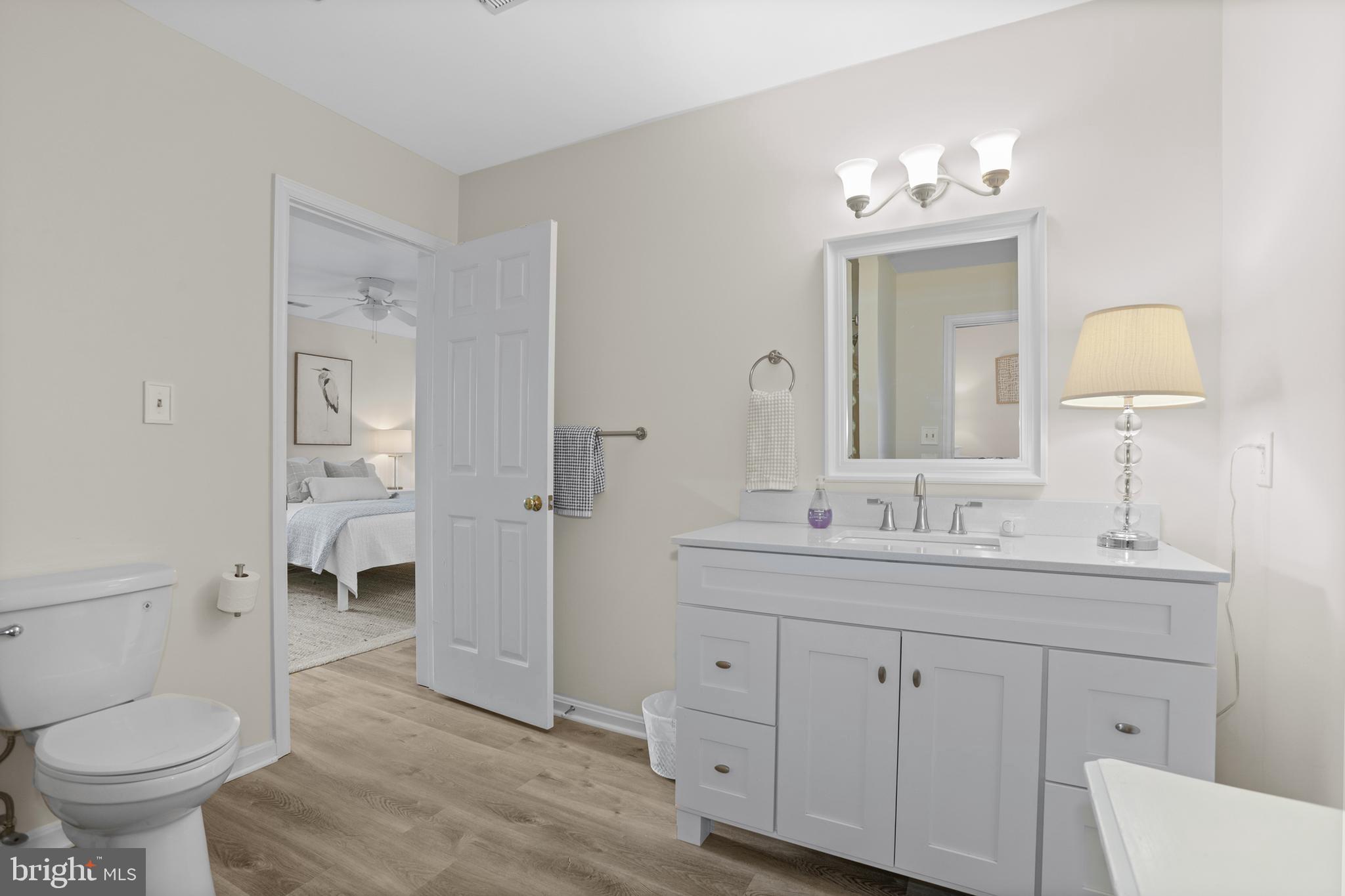 638 Marlborough Point Road Stafford, VA 22554 - Photo 33 of 58 a bathroom with a toilet sink and mirror