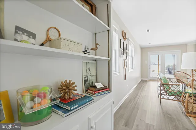 a outdoor living space with furniture and a black umbrella