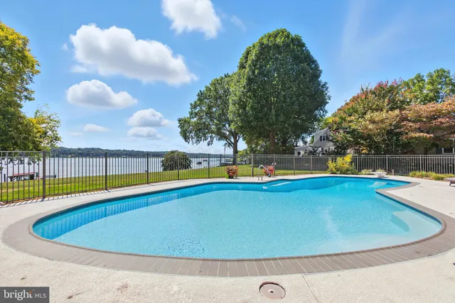 a outdoor space with furniture a rug and a potted plant