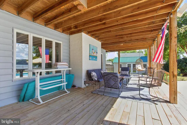 a view of a house with a backyard and plants