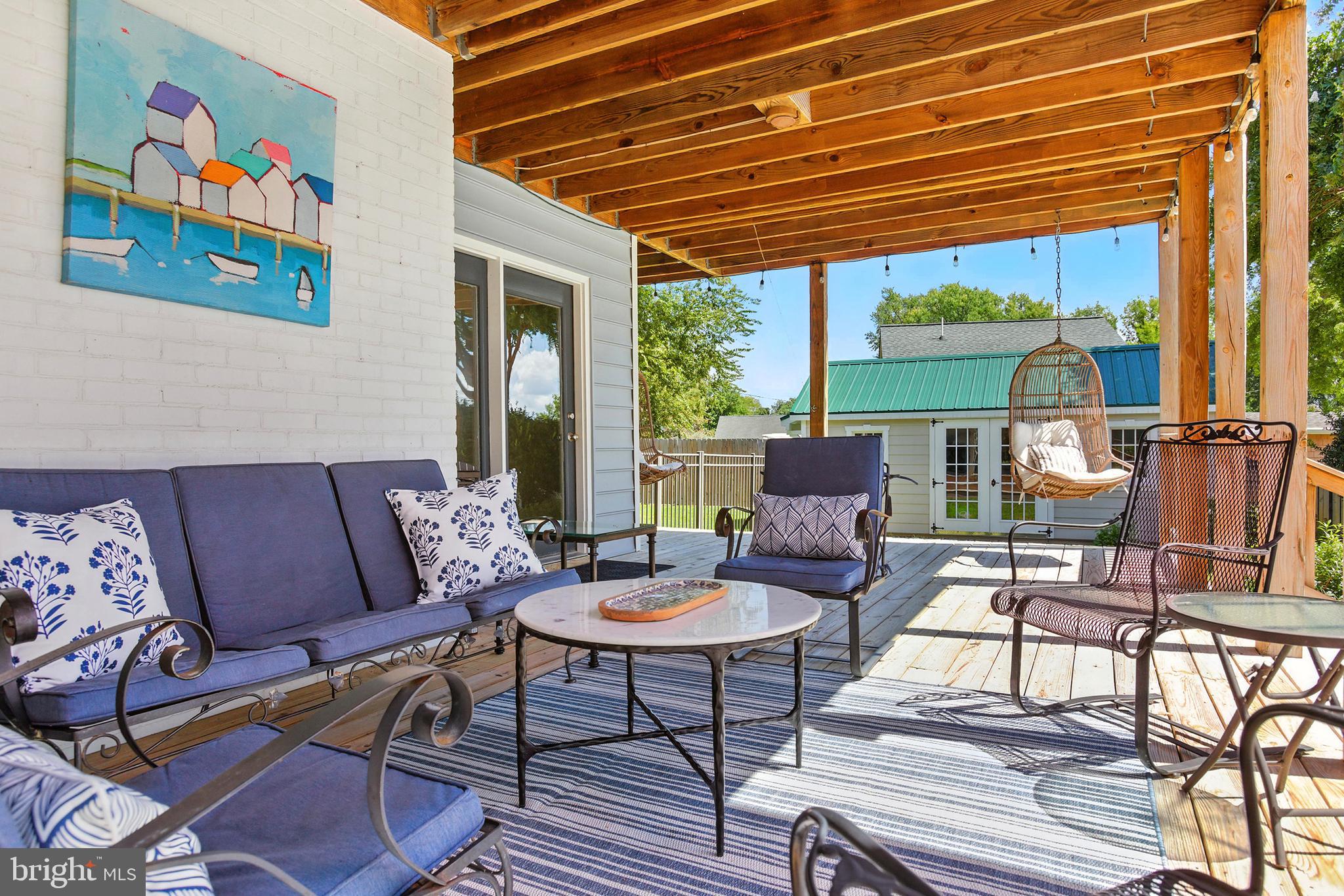 638 Marlborough Point Road Stafford, VA 22554 - Photo 41 of 58 a outdoor living space with furniture and a black umbrella