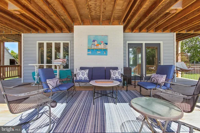 a view of a lake with a table and chairs