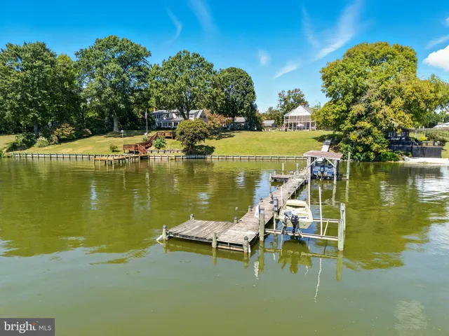 an aerial view of a house with a lake view