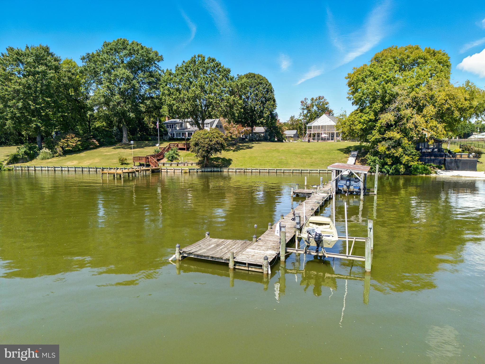 638 Marlborough Point Road Stafford, VA 22554 - Photo 48 of 58 a view of a lake with a table and chairs