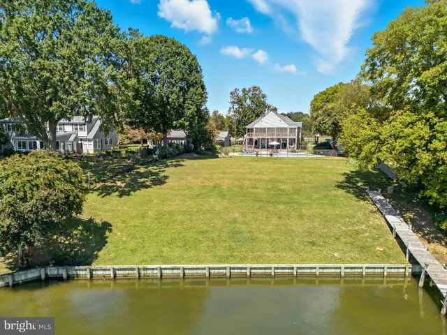 a sign that is sitting on a side of a tree