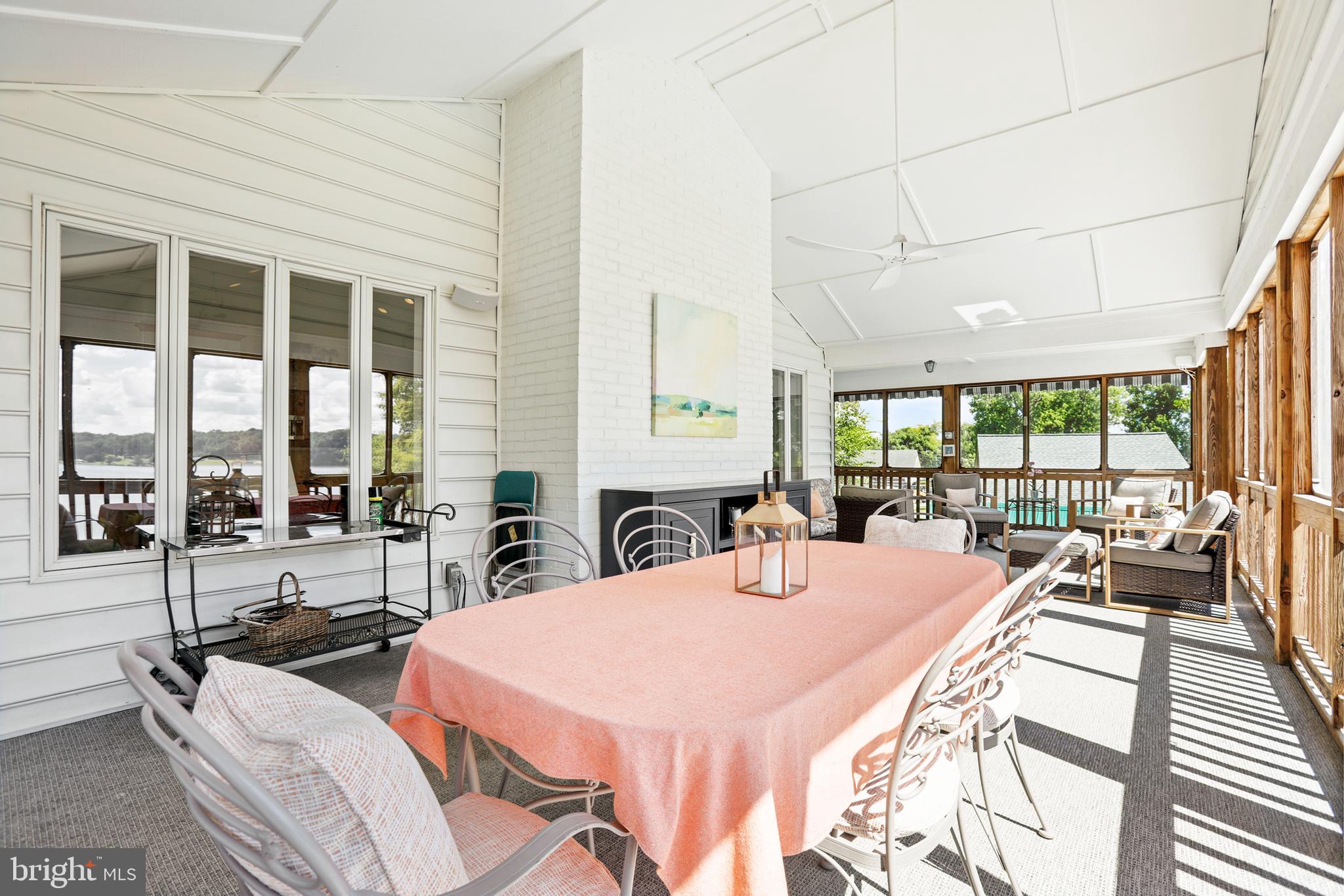 638 Marlborough Point Road Stafford, VA 22554 - Photo 5 of 58 a view of a dining room with furniture large windows and wooden floor