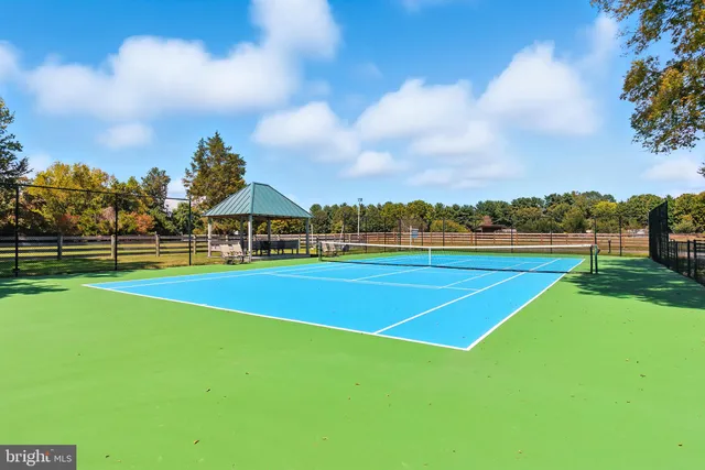 a view of a dining room with furniture and window
