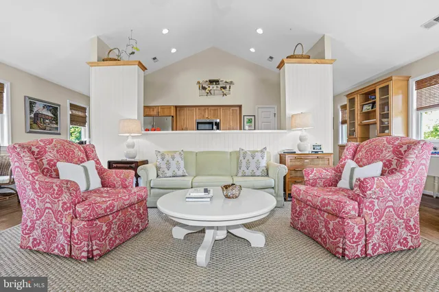 a living room with furniture fireplace and window