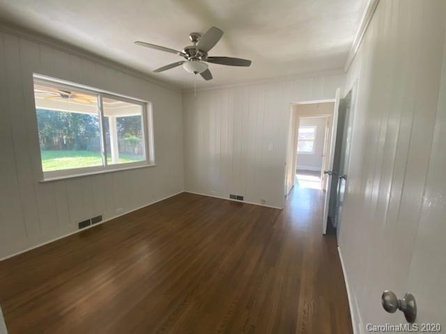 911 Scaleybark Road Charlotte, NC 28209 - Photo 16 of 22 wooden floor in an empty room with a window