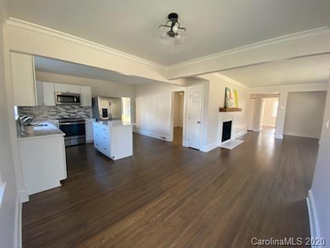 911 Scaleybark Road Charlotte, NC 28209 - Photo 17 of 22 a view of a kitchen cabinets and wooden floor
