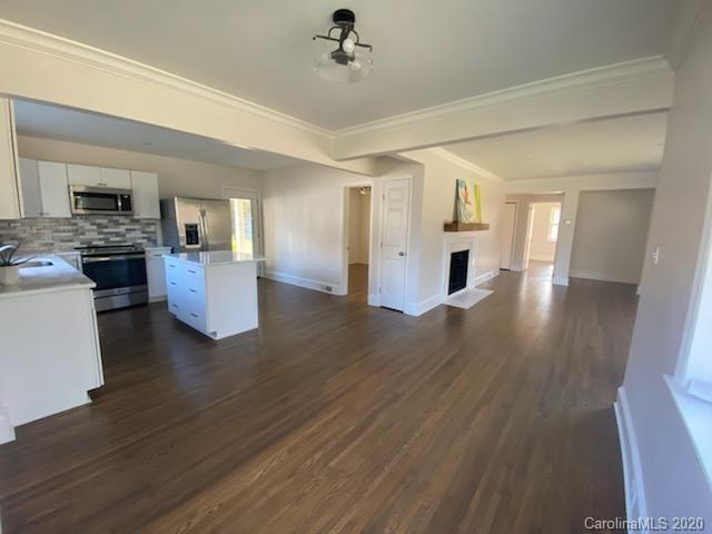 911 Scaleybark Road Charlotte, NC 28209 - Photo 18 of 22 a view of a living room a kitchen and a stove top oven