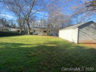 911 Scaleybark Road Charlotte, NC 28209 - Photo 22 of 22 a view of a backyard with large trees