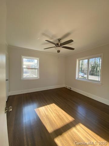 911 Scaleybark Road Charlotte, NC 28209 - Photo 8 of 22 a view of an empty room and wooden floor