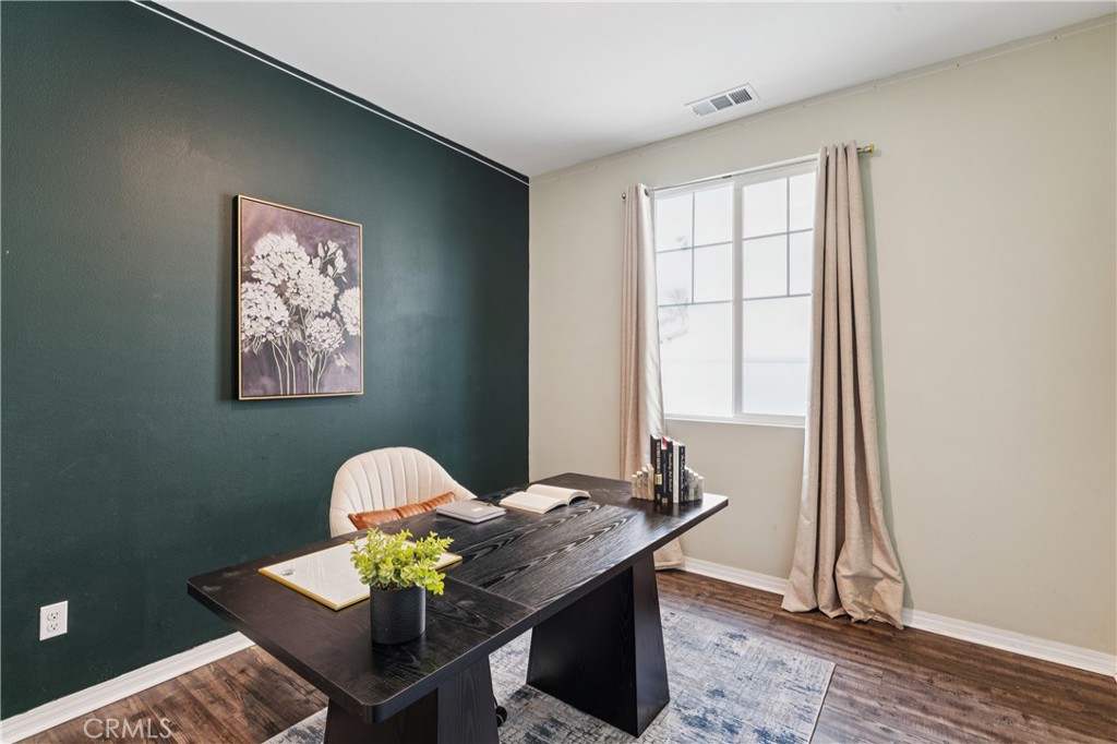 30535 Ridgely Way Menifee, CA 92584 - Photo 11 of 37 a dining room with furniture and wooden floor