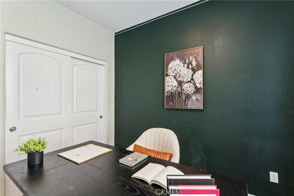 30535 Ridgely Way Menifee, CA 92584 - Photo 12 of 37 a room with chair and a potted plant