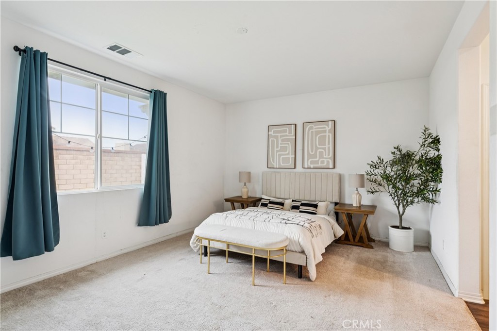 30535 Ridgely Way Menifee, CA 92584 - Photo 24 of 37 a bedroom with a bed and a window