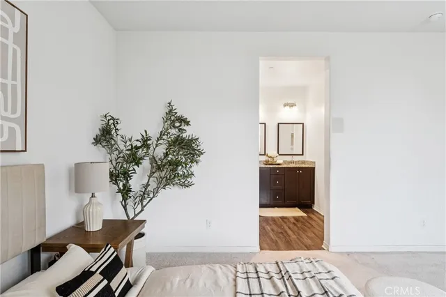 a bedroom with furniture and a bathroom