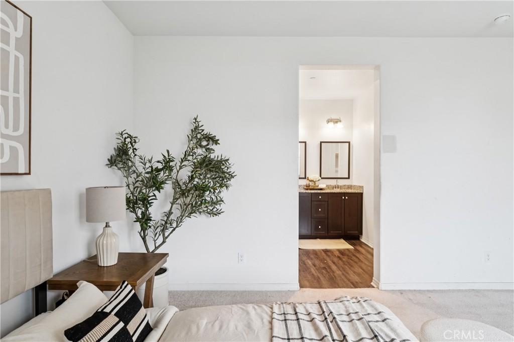 30535 Ridgely Way Menifee, CA 92584 - Photo 25 of 37 a living room with furniture and a potted plant