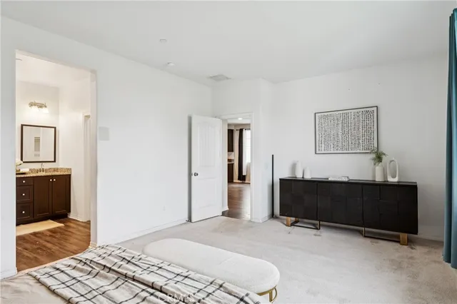 a bathroom with double vanity sinks and a mirror
