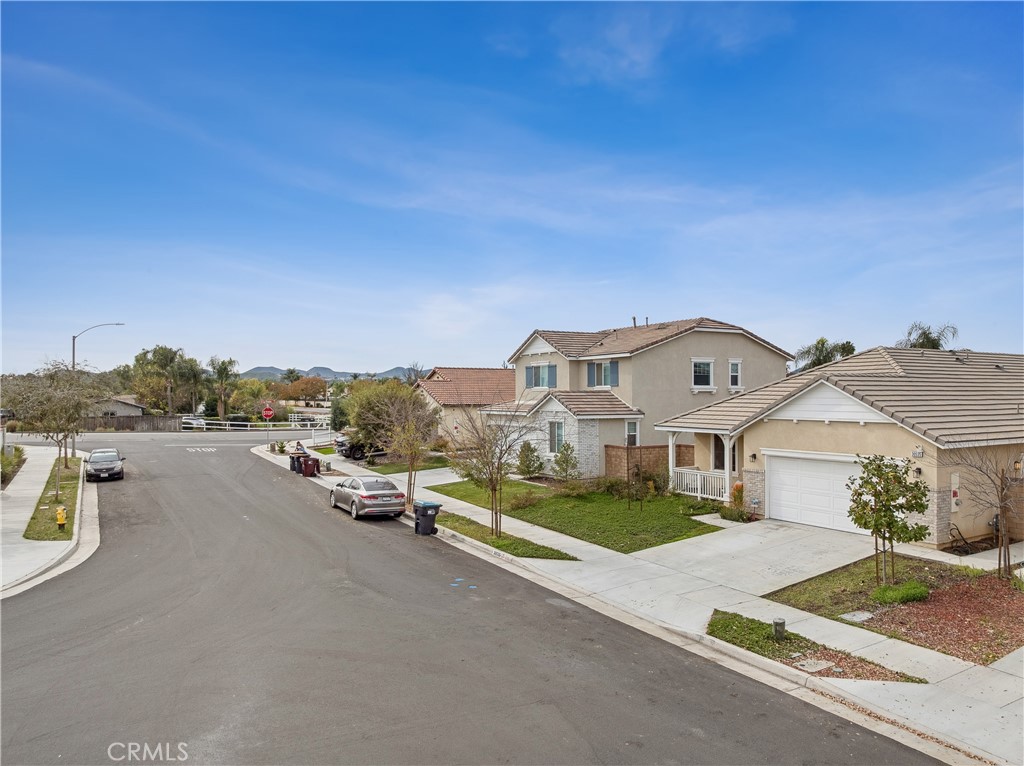 30535 Ridgely Way Menifee, CA 92584 - Photo 35 of 37 a view of a street with houses
