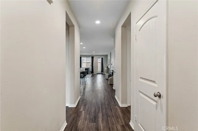 an empty room with wooden floor and closet