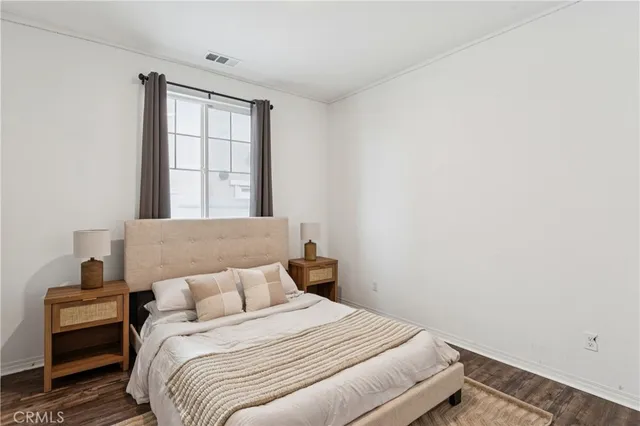 a view of a room with wooden floor and closet