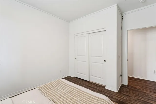 a bathroom with a granite countertop sink toilet a mirror and shower