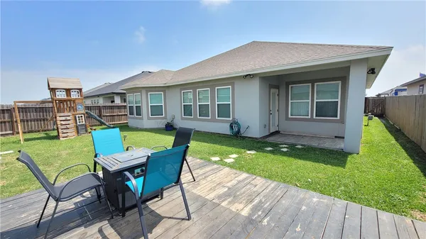a view of an house with backyard from a tub