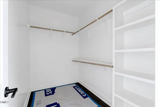 a view of an empty walk in closet