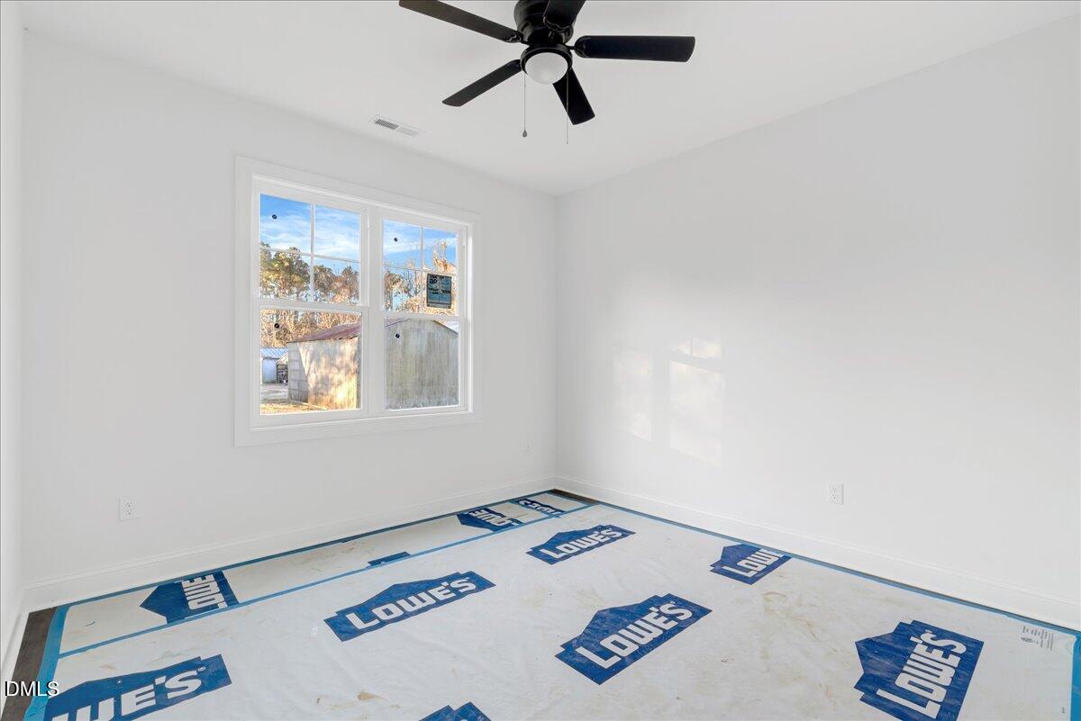 207 Terrell Street Norlina, NC 27563 - Photo 13 of 23 a view of a workspace with furniture and window