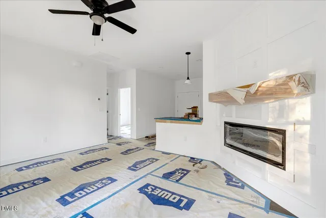 a bedroom with furniture and a fireplace