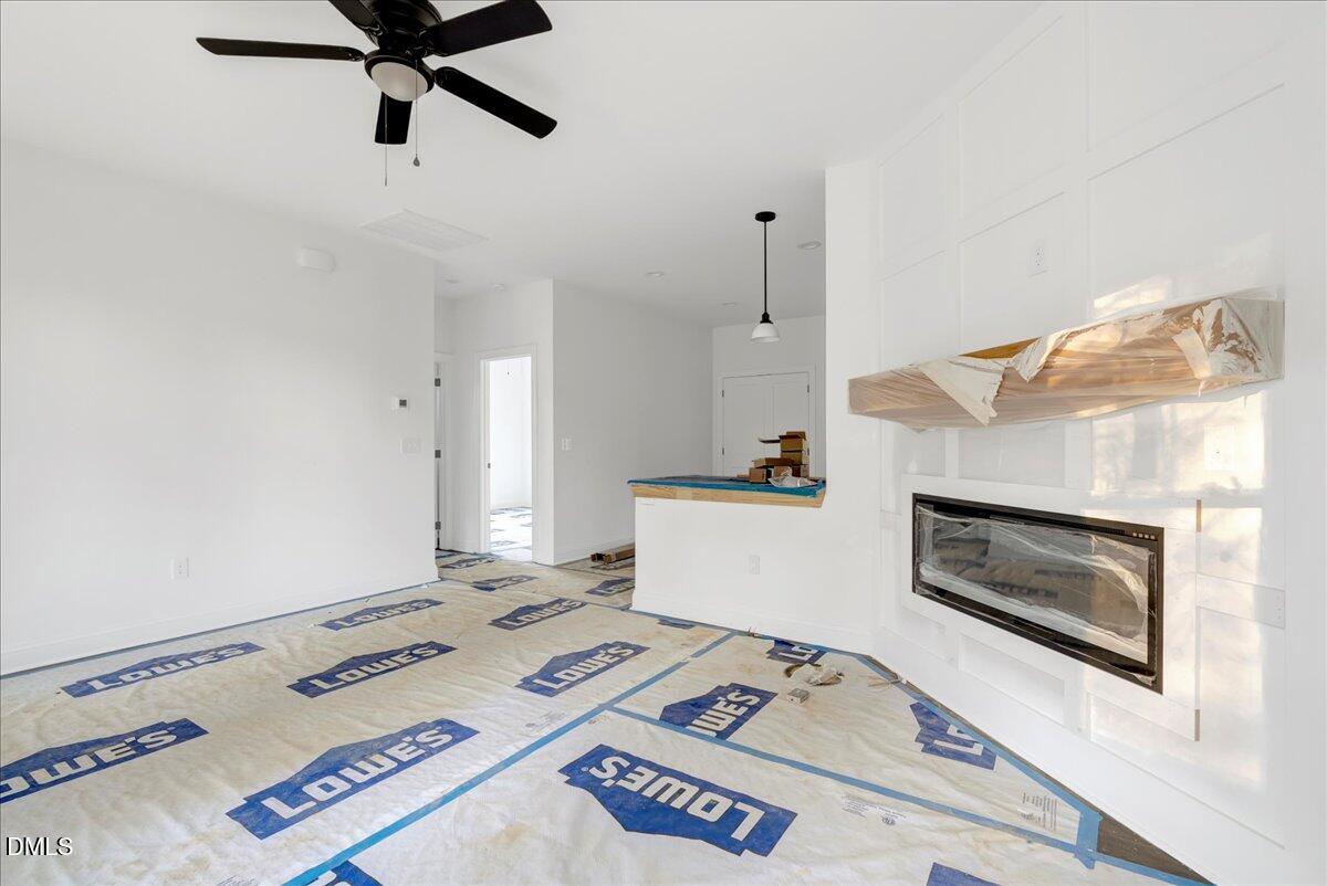 207 Terrell Street Norlina, NC 27563 - Photo 3 of 23 a bedroom with furniture and a fireplace