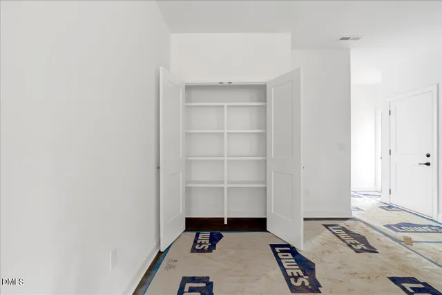 a room with a bed and a window