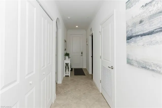 a view of a hallway with closet and entryway